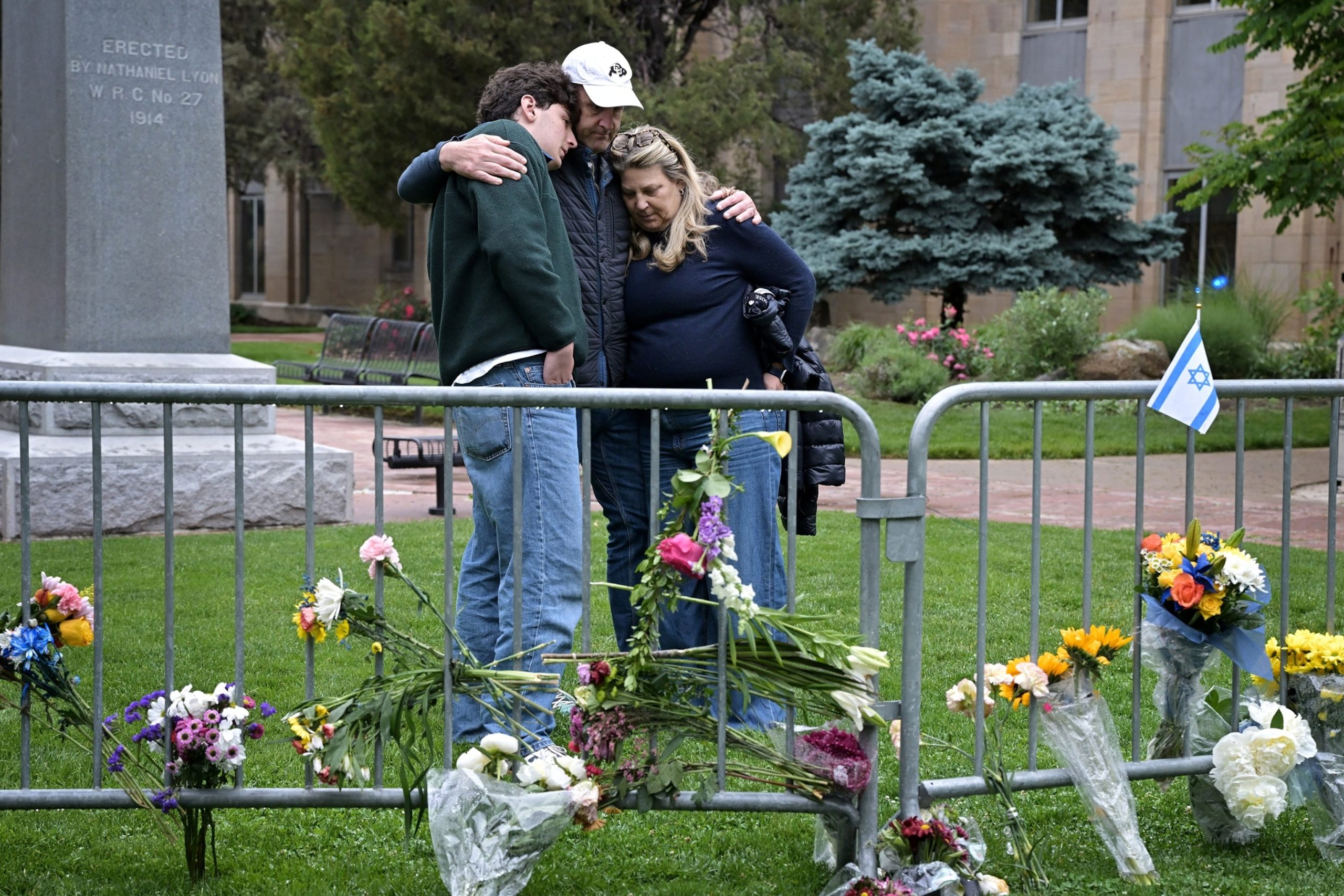 PHOTO: In this June 3, 2025, file photo, Isaac Dechtman of Denver hugs his parents Evan and Jennifer at the Boulder county courthouse on Pearl Street in Boulder.