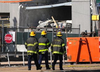 1 dead, 2 missing after under-construction parking garage partially collapses: Mayor