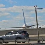 WATCH: United flight hits light pole while landing