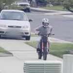 WATCH: Woman arrested after driving on sidewalk toward child riding bike, police say