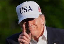 Trump isn’t on the ballot in Georgia, but he could decide Tuesday’s races
