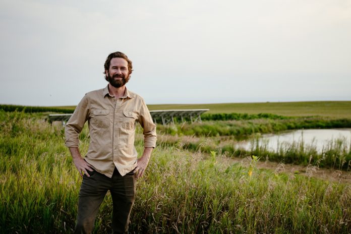 Tanner Faaborg poses for a photo at his farm in central Iowa. The Faaborg family grows specialty mushrooms at 1100 Farm in central Iowa.