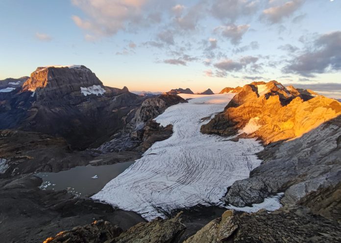 A Swiss glacier shows the effects of years of ice loss, with exposed rock replacing ice that once covered the landscape.