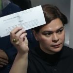 Philippines Vice President Sara Duterte posts bail after arrest Philippine Vice President Sara Duterte shows a document to reporters at the Quezon city justice hall Saturday, Sept. 5, 2026, after an arrest warrant was issued on charges that she publicly threatened to have the president and two other people assassinated.
