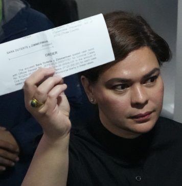 Philippines Vice President Sara Duterte posts bail after arrest Philippine Vice President Sara Duterte shows a document to reporters at the Quezon city justice hall Saturday, Sept. 5, 2026, after an arrest warrant was issued on charges that she publicly threatened to have the president and two other people assassinated.