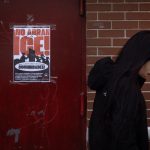 New report shows the economic toll of ICE raids A poster calling on U.S. Immigration and Customs Enforcement (ICE) to get out of the community hangs on a door in the Little Village neighborhood on January 22, 2025 in Chicago, Illinois.