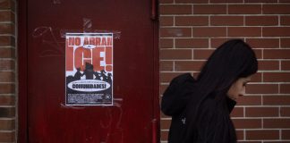New report shows the economic toll of ICE raids A poster calling on U.S. Immigration and Customs Enforcement (ICE) to get out of the community hangs on a door in the Little Village neighborhood on January 22, 2025 in Chicago, Illinois.