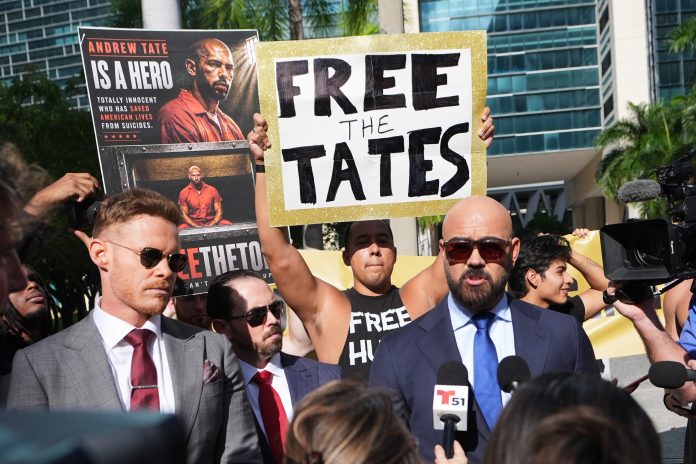 Attorney Joe McBride, right, represents Andrew and Tristan Tate as they fight extradition to the U.K. on charges of rape and human trafficking. McBride spoke to the media before an Aug. 27 bond hearing in Miami.