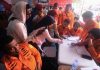 Indonesian passenger ship overturns, sparking search for about 130 missing People look for the names of their family members on a passenger list after a ferry overturned in bad weather in the Java Sea, at the rescuers command center in Banjarmasin, South Kalimantan, Indonesia, Sunday, Sept. 13, 2026.