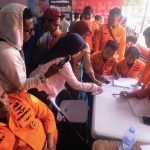 Indonesian passenger ship overturns, sparking search for about 130 missing People look for the names of their family members on a passenger list after a ferry overturned in bad weather in the Java Sea, at the rescuers command center in Banjarmasin, South Kalimantan, Indonesia, Sunday, Sept. 13, 2026.