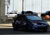 Federal immigration agent shoots and injures man in Austin, Texas Bullet holes can be seen in a car in Austin, Texas, on Sunday.