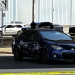 Federal immigration agent shoots and injures man in Austin, Texas Bullet holes can be seen in a car in Austin, Texas, on Sunday.