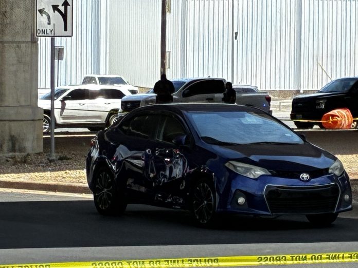 Bullet holes can be seen in a car in Austin, Texas, on Sunday.