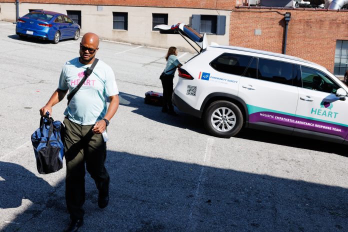 Rob Crisp, a peer support specialist with the Holistic Empathetic Assistance Response Team (HEART) program, responds to a call for a wellness check at a parking lot in Durham, N.C., on Sept. 14.