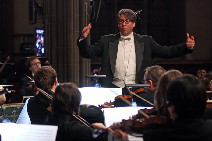 Julian Wachner conducting the Choir of Trinity Wall Street with the Trinity Baroque Orchestra in 2013.