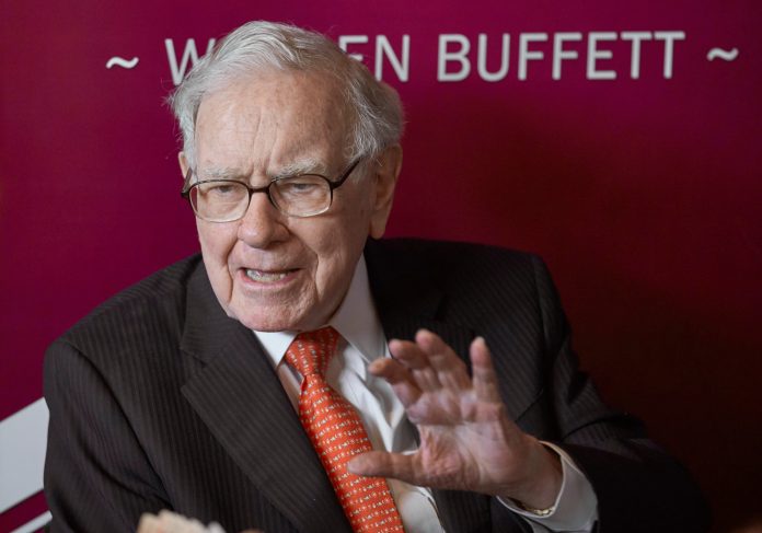 FILE - Warren Buffett, chairman and CEO of Berkshire Hathaway, speaks during a game of bridge following the annual Berkshire Hathaway shareholders meeting May 5, 2019, in Omaha, Neb.