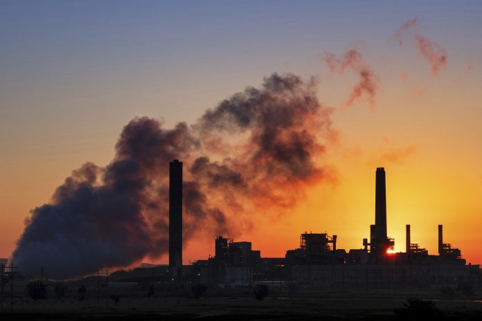 A coal-fired power plant is silhouetted against the morning sun on July 27, 2018, in Glenrock, Wyo. The EPA on Monday announced it