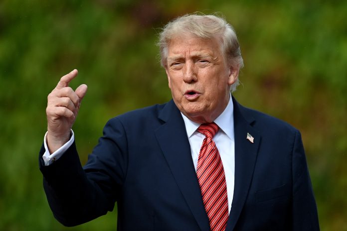 U.S. President Donald Trump reacts towards members of the media after a courtesy call with Irish President Catherine Connolly at Áras an Uachtaráin on September 12, 2026 in Dublin, Ireland.