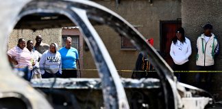 South Africa reels from spate of mass shootings that killed 38 people in a week Community members stand at scene of a mass shooting on Saturday night when suspects opened fire at a bar in Wedela township, southwest of Johannesburg, South Africa, Sunday, Sept. 27, 2026.