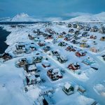 US and Denmark reach deal to build US military presence in Greenland Houses covered in snow are seen on the coast of a sea inlet of Nuuk, Greenland, March 7, 2025.