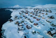 US and Denmark reach deal to build US military presence in Greenland Houses covered in snow are seen on the coast of a sea inlet of Nuuk, Greenland, March 7, 2025.