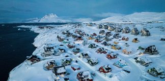 US and Denmark reach deal to build US military presence in Greenland Houses covered in snow are seen on the coast of a sea inlet of Nuuk, Greenland, March 7, 2025.