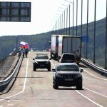 Russia and North Korea open the first road across their shared border In this photo released by the Government of Primorsky Krai Region on Monday, Sept. 7, 2026, vehicles drive across the new bridge between Russia and North Korea named after the Soviet officer Yakov Novichenko, who is credited with saving North Korea