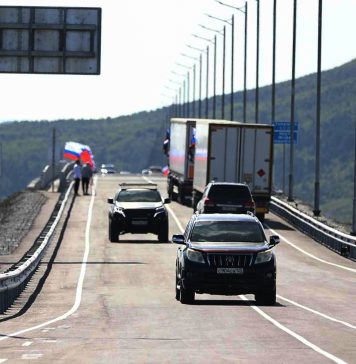 Russia and North Korea open the first road across their shared border In this photo released by the Government of Primorsky Krai Region on Monday, Sept. 7, 2026, vehicles drive across the new bridge between Russia and North Korea named after the Soviet officer Yakov Novichenko, who is credited with saving North Korea
