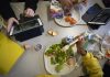 Seventh-graders sit together in the cafeteria during their lunch break at a public school in Brooklyn, N.Y., on Feb. 10, 2023.