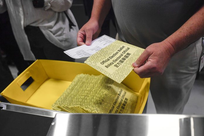 In this file photo from 2024, Pennsylvania poll workers demonstrate how ballots are are received, processed, scanned, and securely stored.