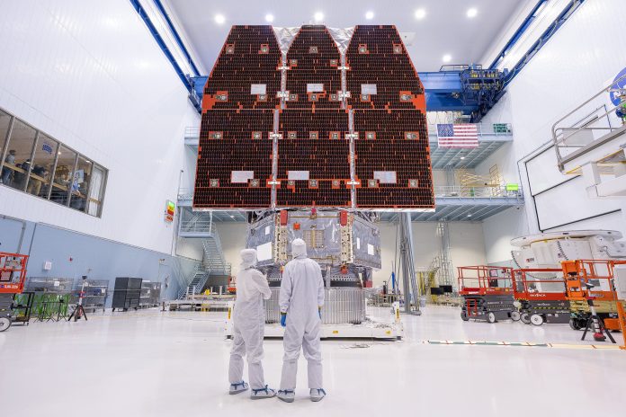 Technicians connect the inner and outer segments of NASA