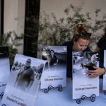 The driver who slammed into an LA bus before helicopter crash is charged with murder Savannah Sampson, right, and Nicole Lewis, help set up a vigil for the victims of Tuesday