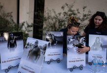 The driver who slammed into an LA bus before helicopter crash is charged with murder Savannah Sampson, right, and Nicole Lewis, help set up a vigil for the victims of Tuesday