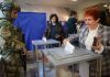 Russia holds parliamentary vote in areas it seized from Ukraine in the war Voters cast ballots at a polling station during Russia