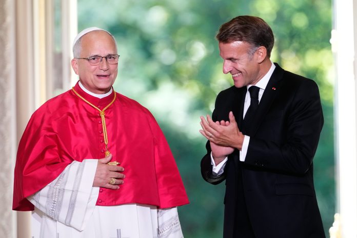 Pope Leo XIV, left, and French President Emmanuel Macron, attend a joint statement at the Elysee Palace, Friday, Sept. 25, 2026.