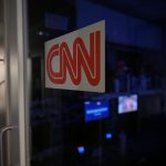 News organizations ask court to bar White House enforcement of access ban A logo on a booth for CNN is seen in the press area at the White House, Saturday, Sept. 26, 2026, in Washington.