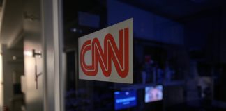 News organizations ask court to bar White House enforcement of access ban A logo on a booth for CNN is seen in the press area at the White House, Saturday, Sept. 26, 2026, in Washington.
