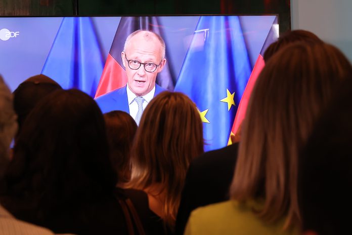 Supporters of the Christian Democratic Union (CDU), German Chancellor Friedrich Merz appears on a screen in a TV studio following the closure of polling stations in Mecklenburg-Western Pomerania state elections on September 20, 2026 in Berlin, Germany.
