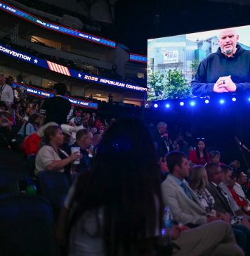 Fetterman, already at odds with his party, makes surprise video for GOP convention Sen. John Fetterman, D-Pa., is displayed on a screen as he delivers a video message during the Republican National Midterm Convention at the American Airlines Center in Dallas on Wednesday.