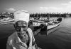 PHOTOS: The precarious life of fisherfolk Pavadairayan, 60, a migrant laborer known as a "basket man," carries fish in a basket on his head from boats to the auction house at Kasimedu Fishing Harbour in Chennai, India.