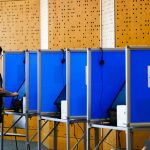 It’s illegal for armed federal officers to be at polls. Lawsuits seek to ensure that A voter casts her ballot in Colorado