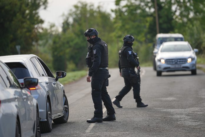 Police guard a road leading to RAF Fairford, in Fairford, England, Monday, Sept. 28, 2026.