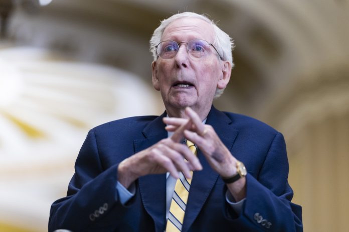 Sen. Mitch McConnell, R-Ky., speaks to the press as he arrives for a vote at the U.S. Capitol on Monday for his first public appearance in over 90 days after he recovered from a fall and illness.