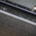In photos: Remembering the Sept. 11 attacks, 25 years later A woman places flowers at the September 11 memorial plaza in Lower Manhattan ahead of a ceremony commemorating the 25th anniversary of the Sept. 11, 2001, attacks at the National September 11 Memorial in New York on Friday.
