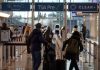 TSA brings back gate access for some people without plane tickets 25 years after 9/11 FILE - Travelers walk through a TSA security checkpoint at Reagan National Airport in Washington, March 24, 2026.