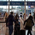 TSA brings back gate access for some people without plane tickets 25 years after 9/11 FILE - Travelers walk through a TSA security checkpoint at Reagan National Airport in Washington, March 24, 2026.